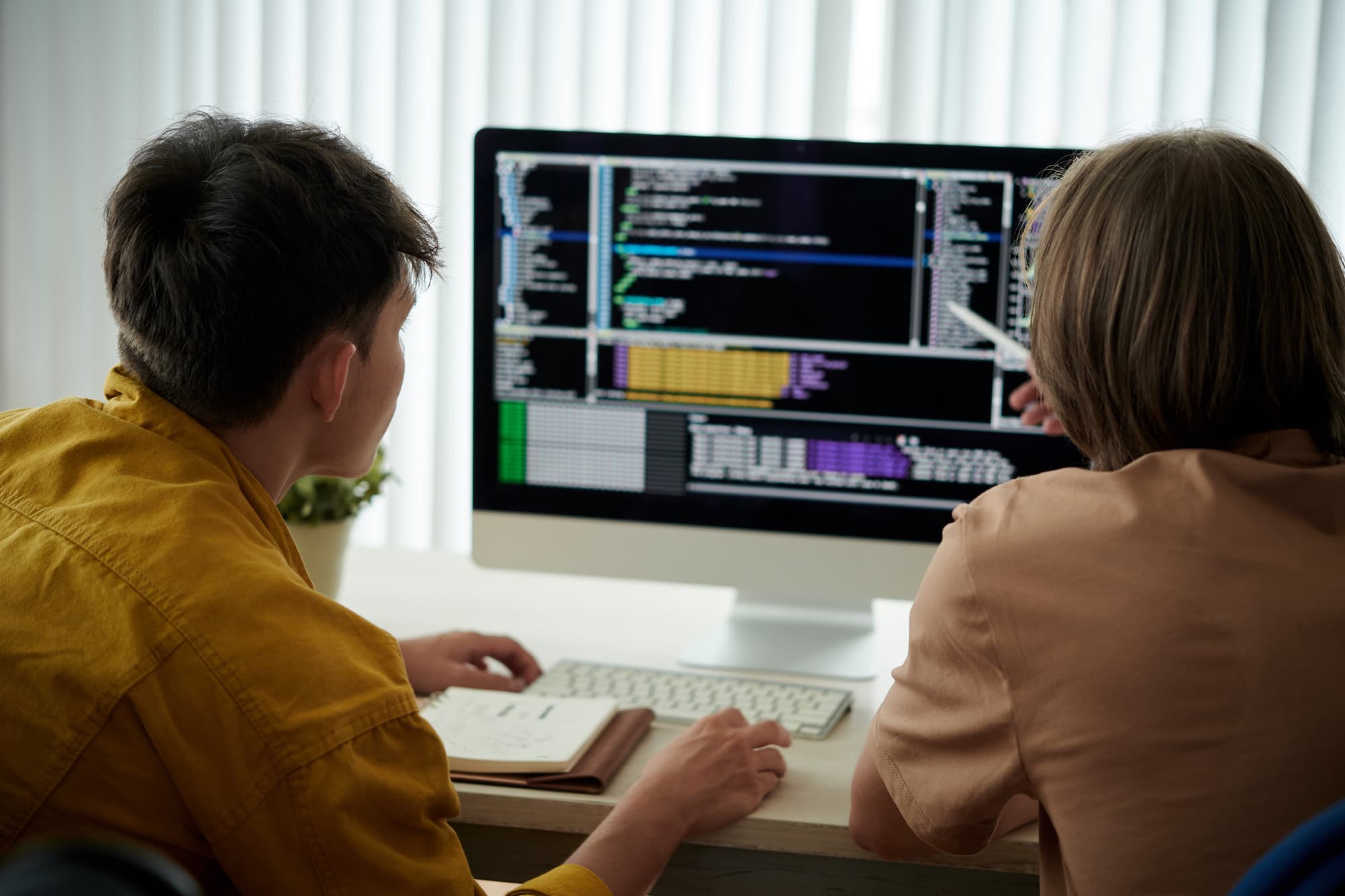 software developers coding at their desk